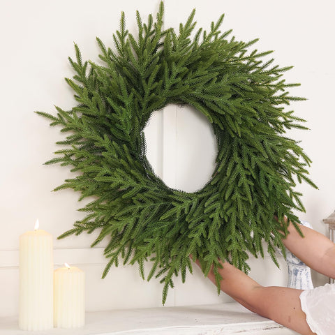 Juxdp wreath lit with battery lights showing warm holiday glow