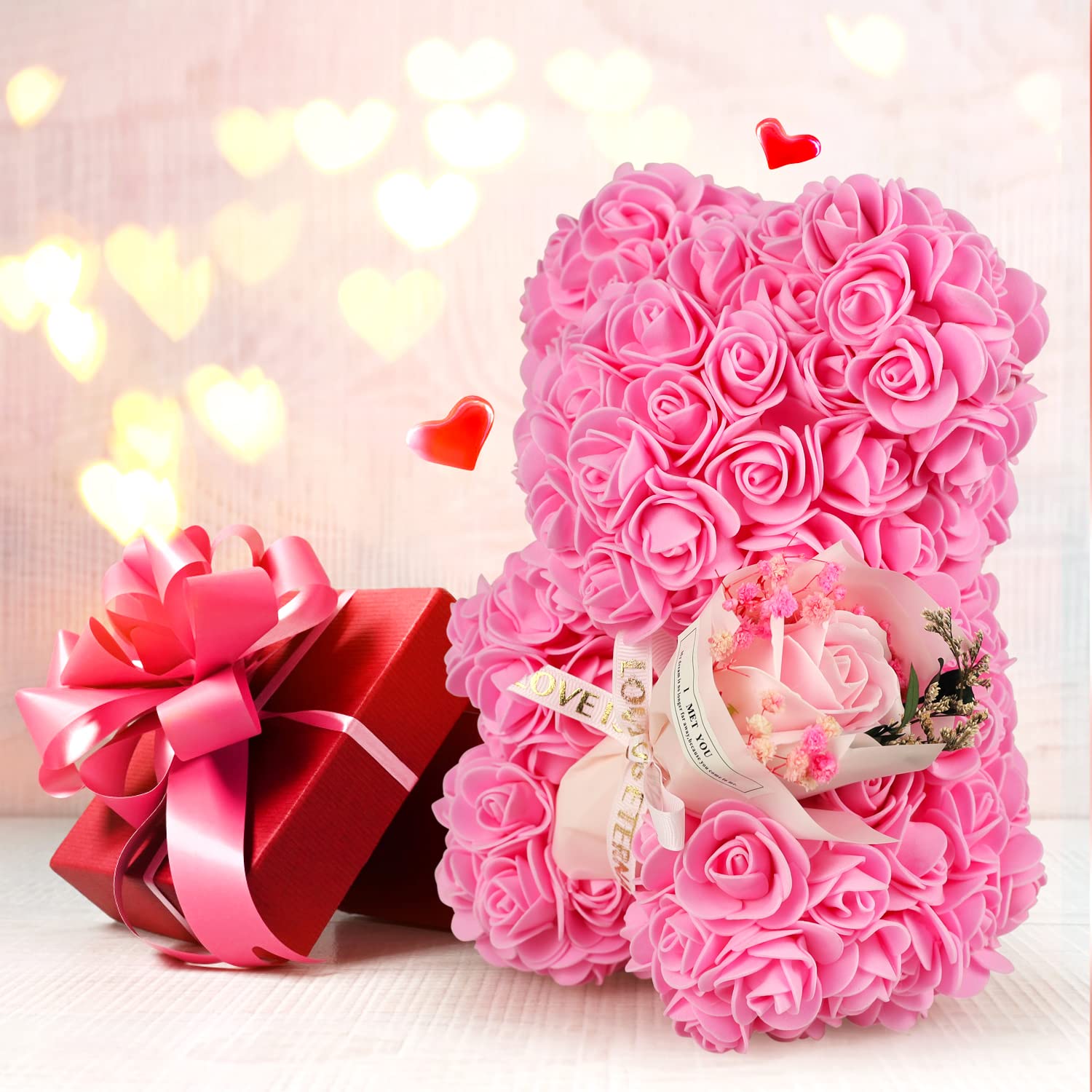 K KYMAKE rose bear held in hand for scale showing compact keepsake convenience