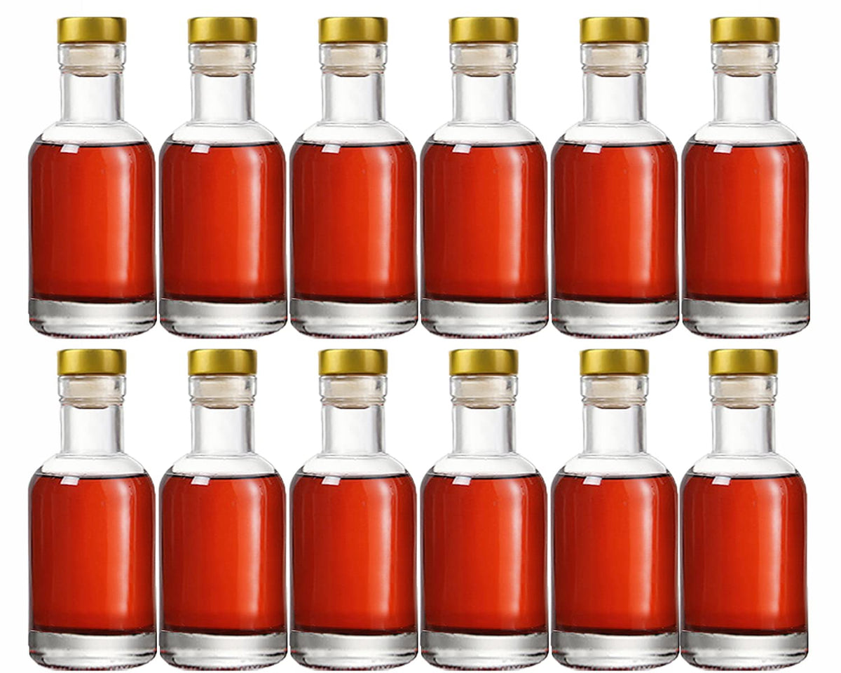 Kaachli front view of 12 clear glass bottles showing set and corks for neat presentation