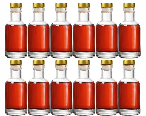 Kaachli front view of 12 clear glass bottles showing set and corks for neat presentation