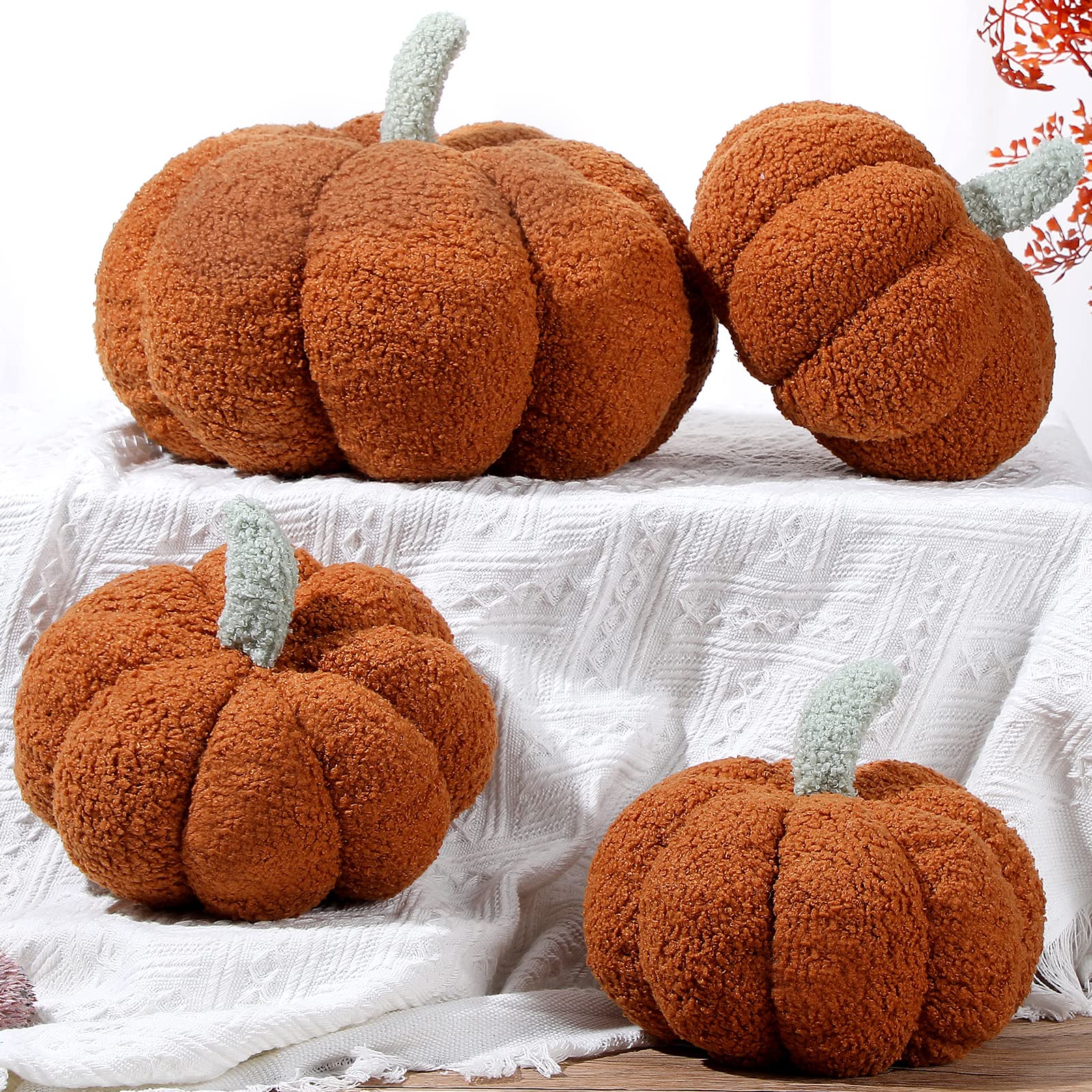 Kajaia pillows styled on a sofa creating an autumnal living room vibe