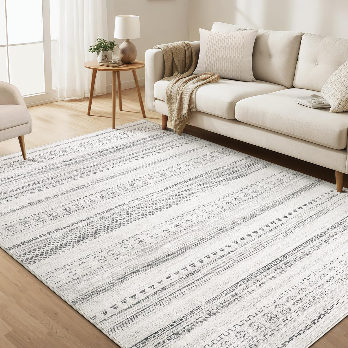 kakania front view 5x7 rug showing geometric boho pattern and calm grey tone benefit: complements decor