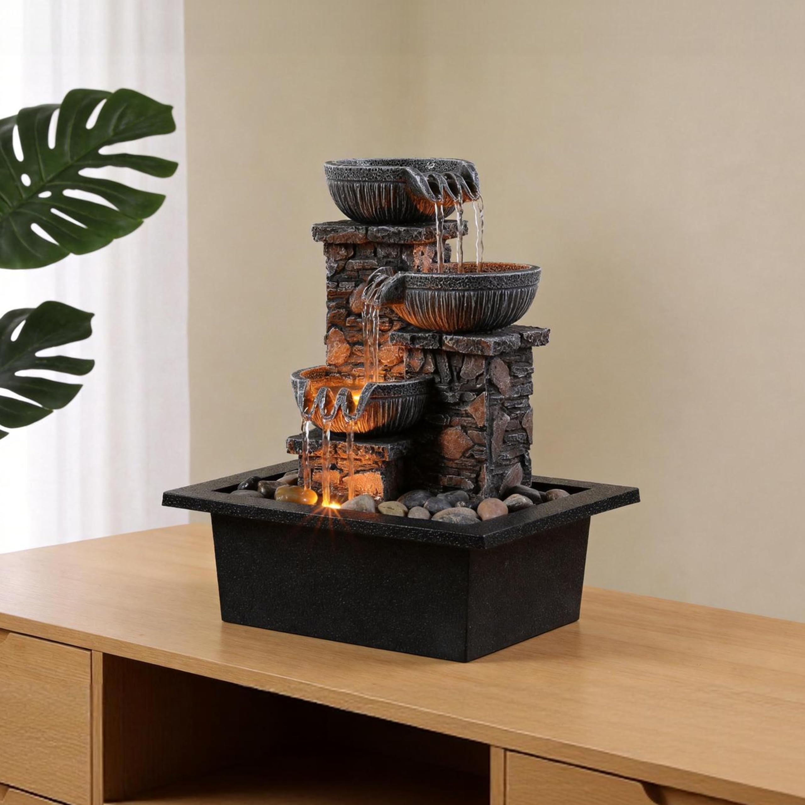 Kalona beside books showing compact size and space-saving benefit