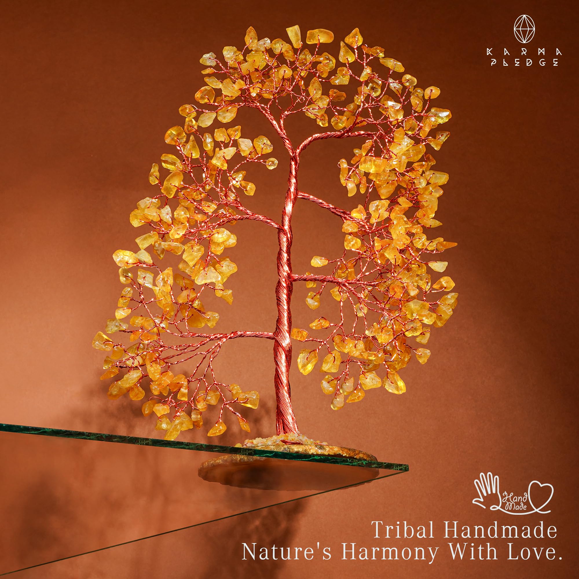 KARMAPLEDGE tree held in hand to show scale and compact tabletop suitability