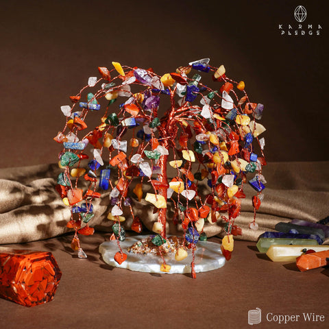 KARMAPLEDGE crystal tree displayed on shelf adding warmth and decorative focus