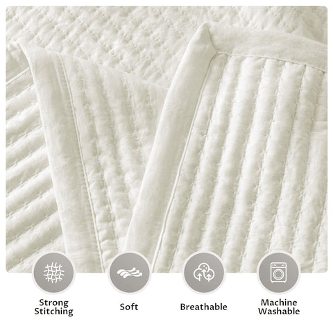 KASENTEX quilt in a styled bedroom demonstrating warm cream-white mood benefit