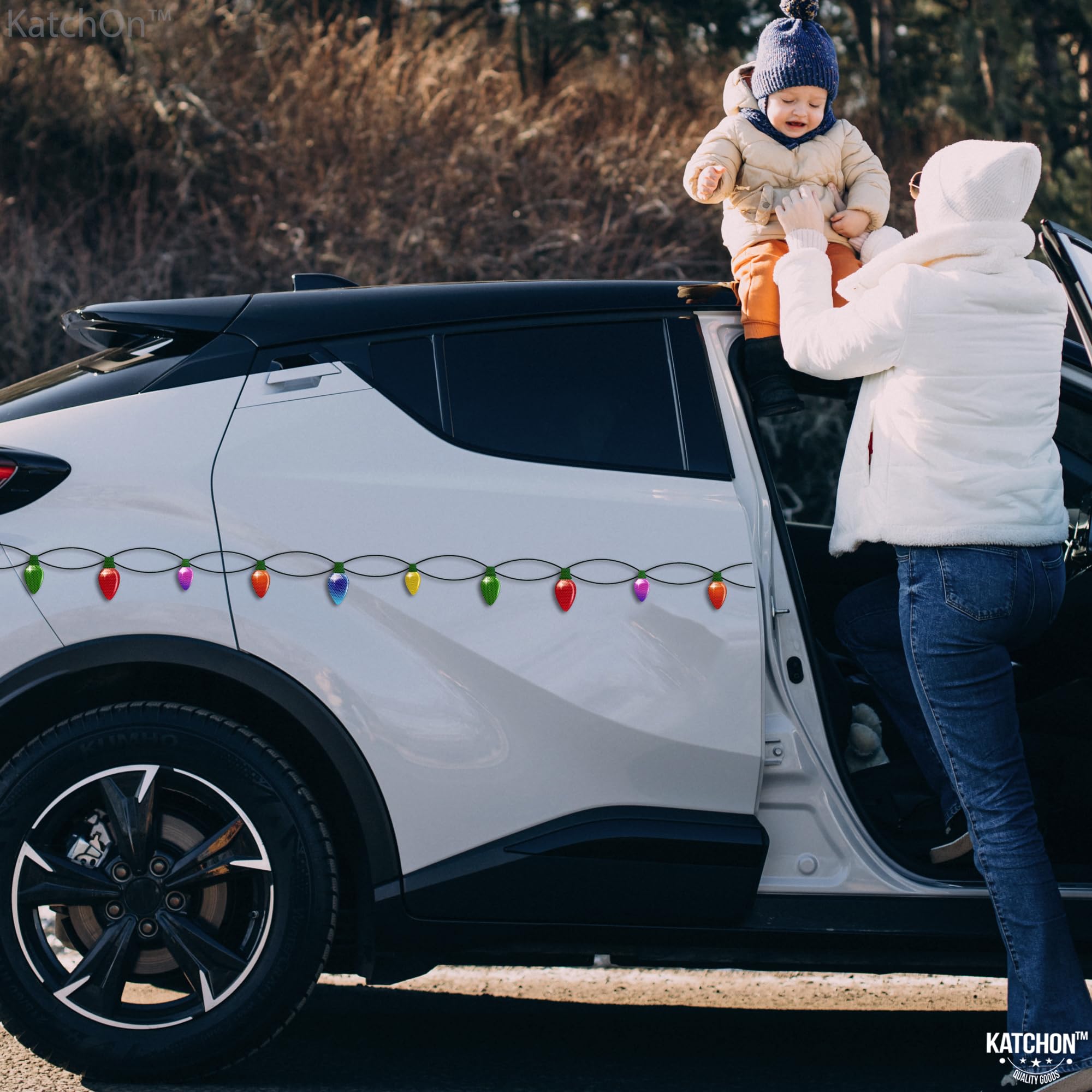 KatchOn family decorating a car together conveying easy, fun holiday setup