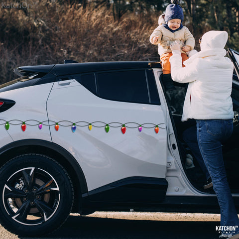 KatchOn family decorating a car together conveying easy, fun holiday setup