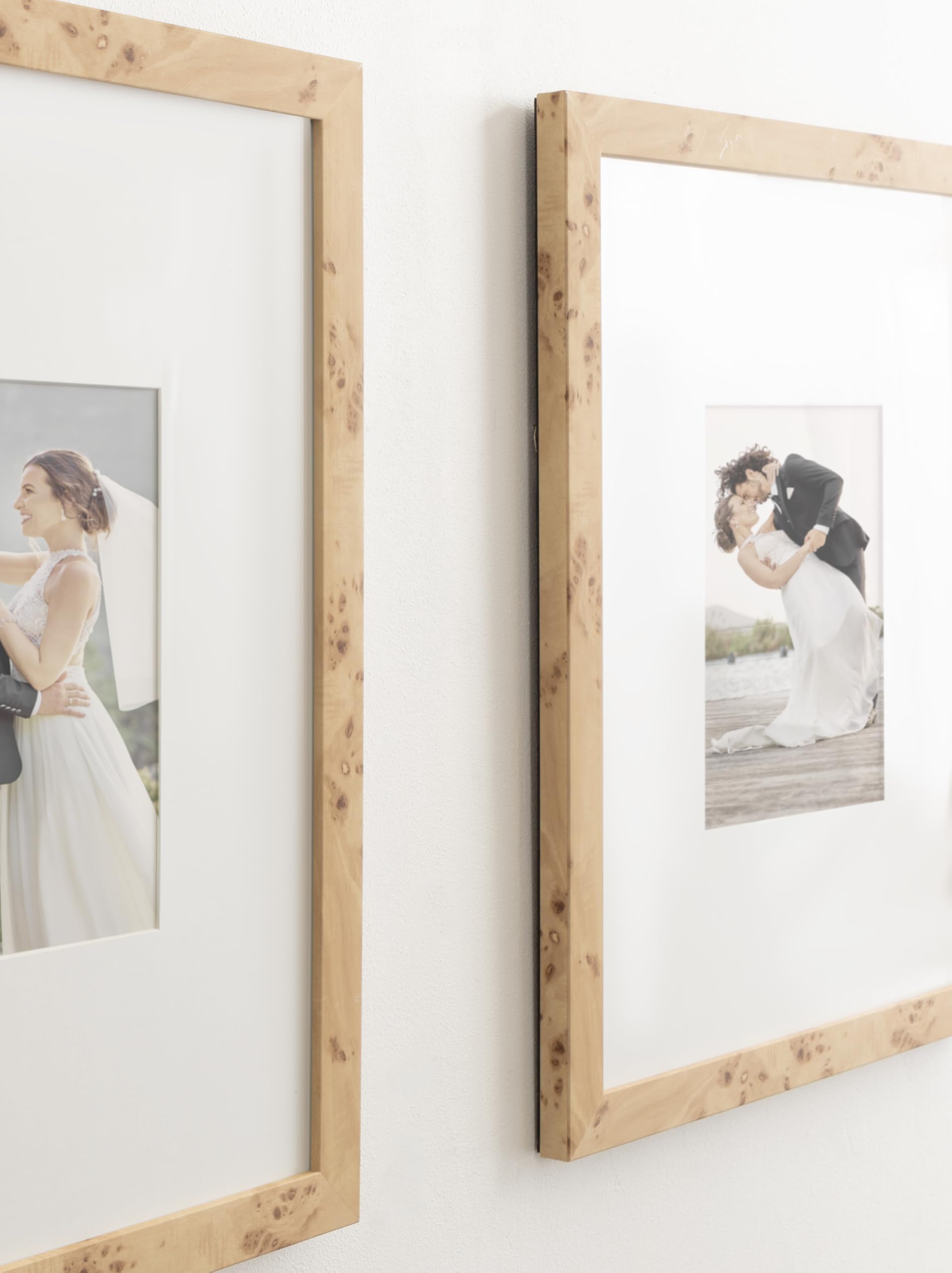 Kate and Laurel framed photos styled above a sofa showing how the set elevates living room decor