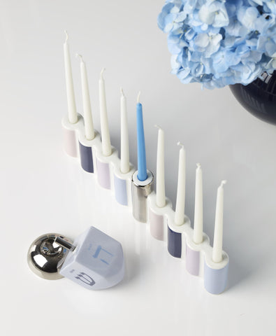 kate spade new york menorah on table with candles and decor to inspire holiday styling