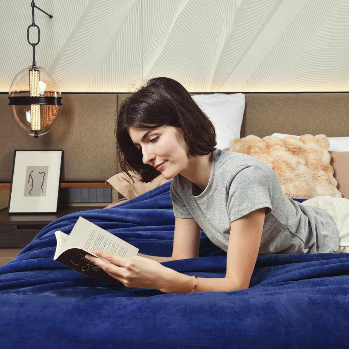 KAWAHOME sherpa on styled bed demonstrates layered bedroom warmth and style