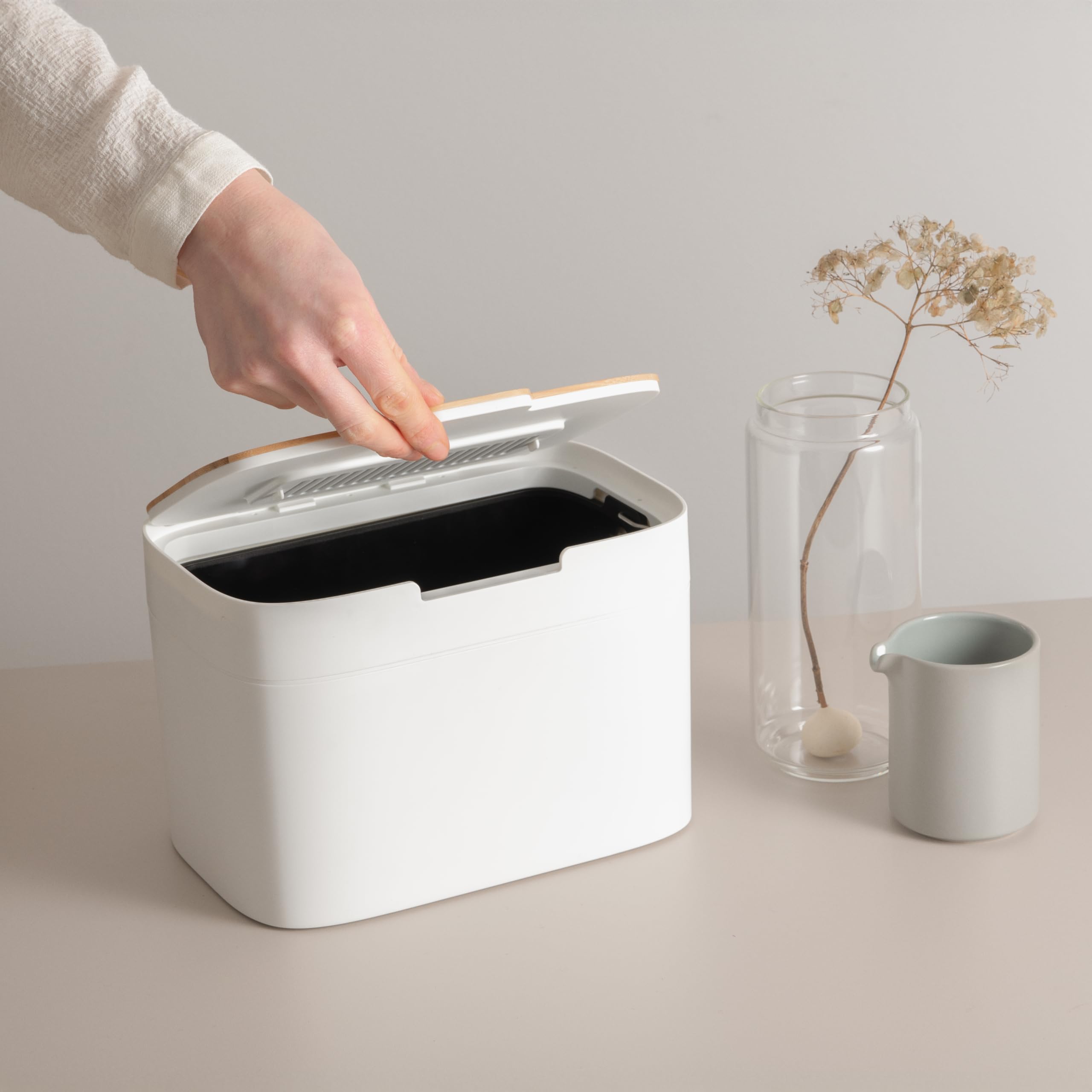KAZAI Elin on a kitchen counter styled with plants to show attractive everyday composting