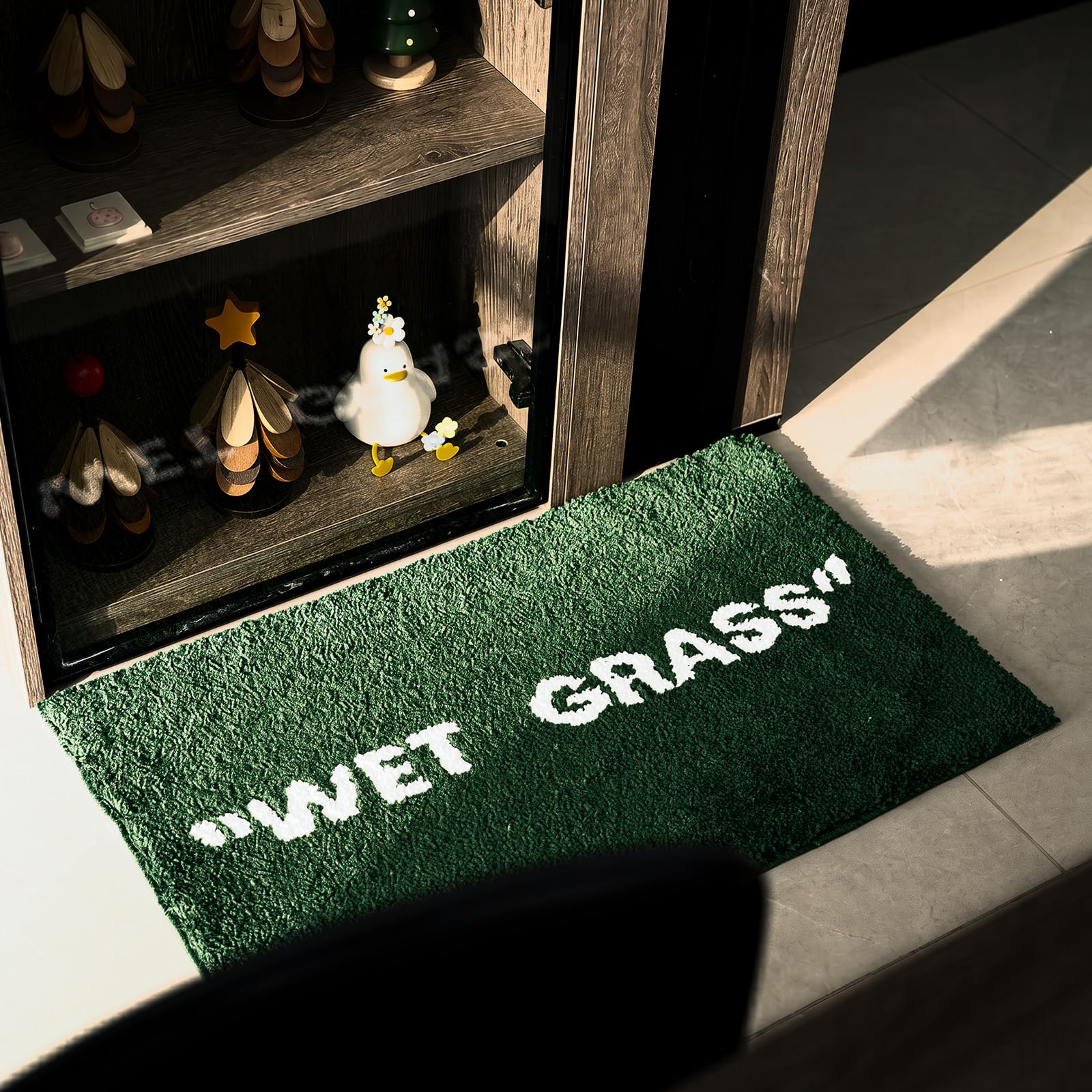 KEEP OFF rug under sneakers for display showing collector-friendly staging