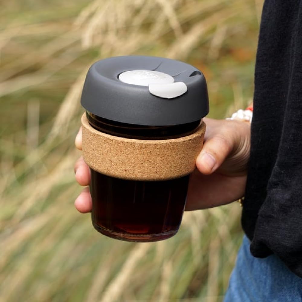 KeepCup filled as barista pours coffee showing accurate cafe pour