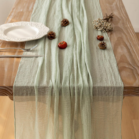 Keketoarrange runner styled with centerpiece adding layered tabletop interest