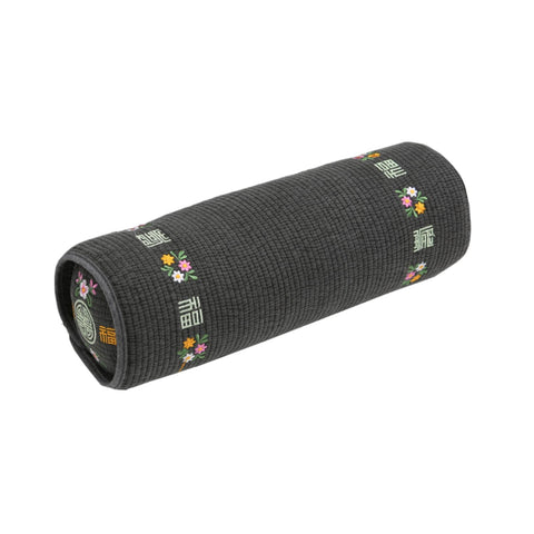 Kepitome front packaging showing compact neck roll and embroidered cotton cover for heritage appeal