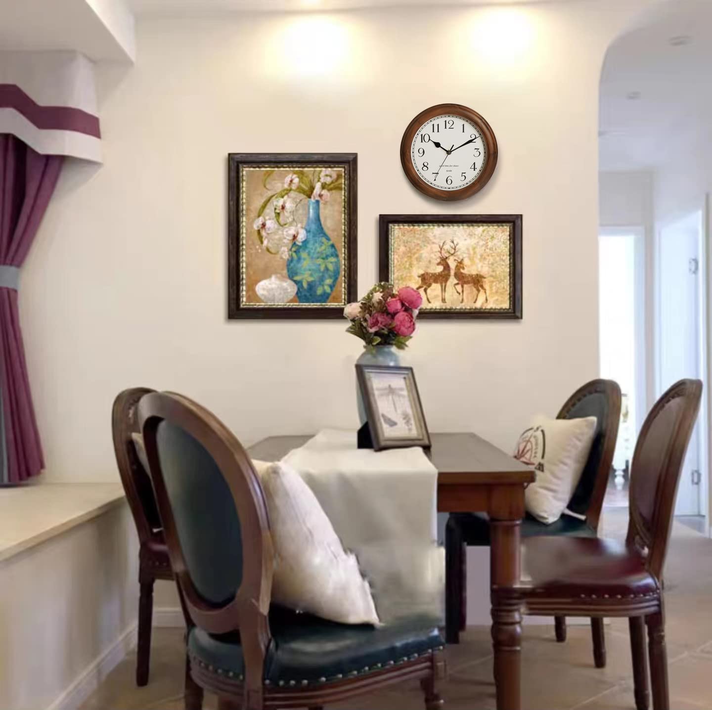 Kesin wall clock next to picture frame showing compact size benefit