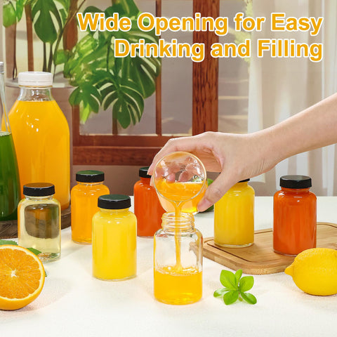 KEYWING pouring juice into jar through wide mouth, makes filling and cleaning easier