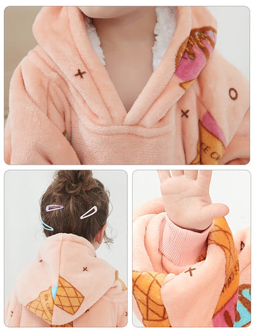 Child wearing KFUBUO hoodie blanket indoors reading, demonstrating comfort