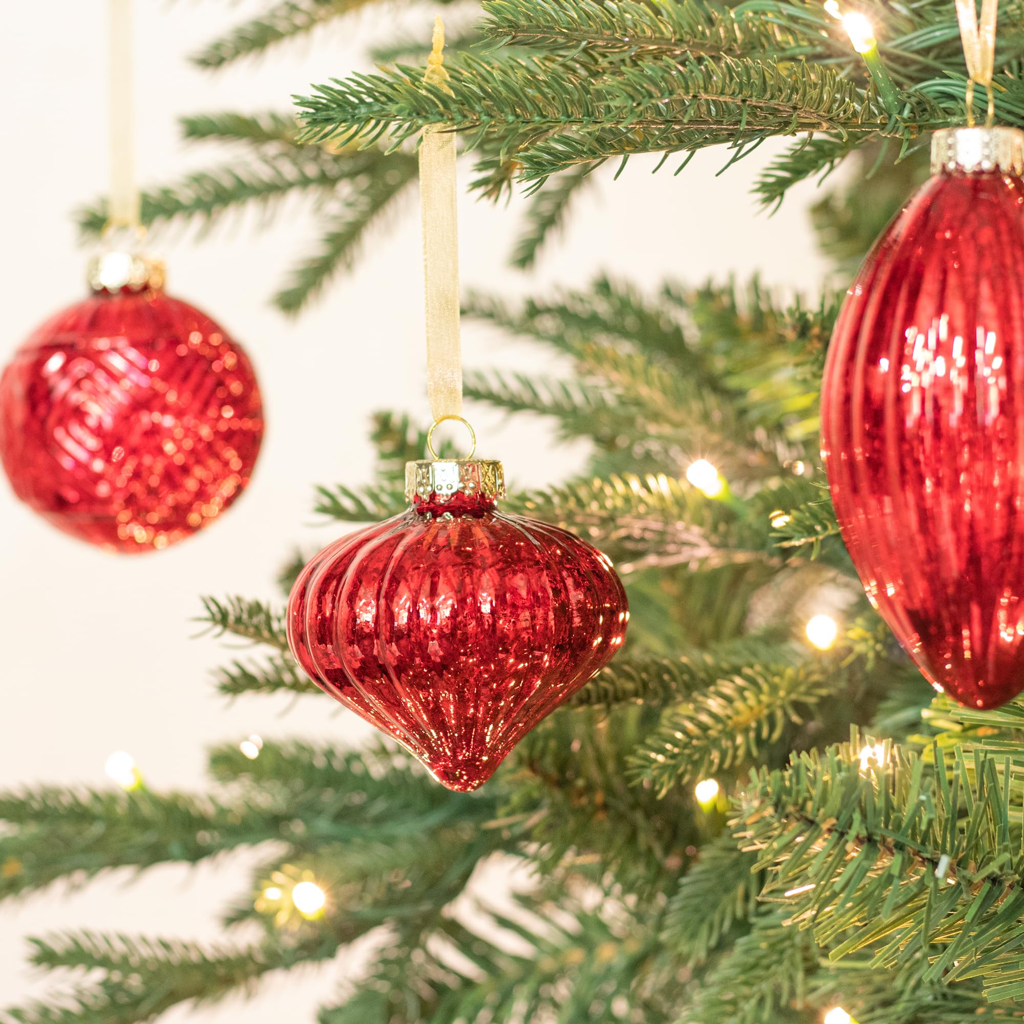 KI Store ornaments grouped as a table centerpiece delivering festive reflective accent