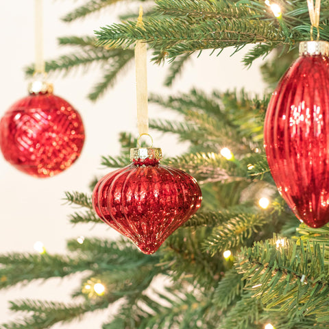 KI Store ornaments grouped as a table centerpiece delivering festive reflective accent