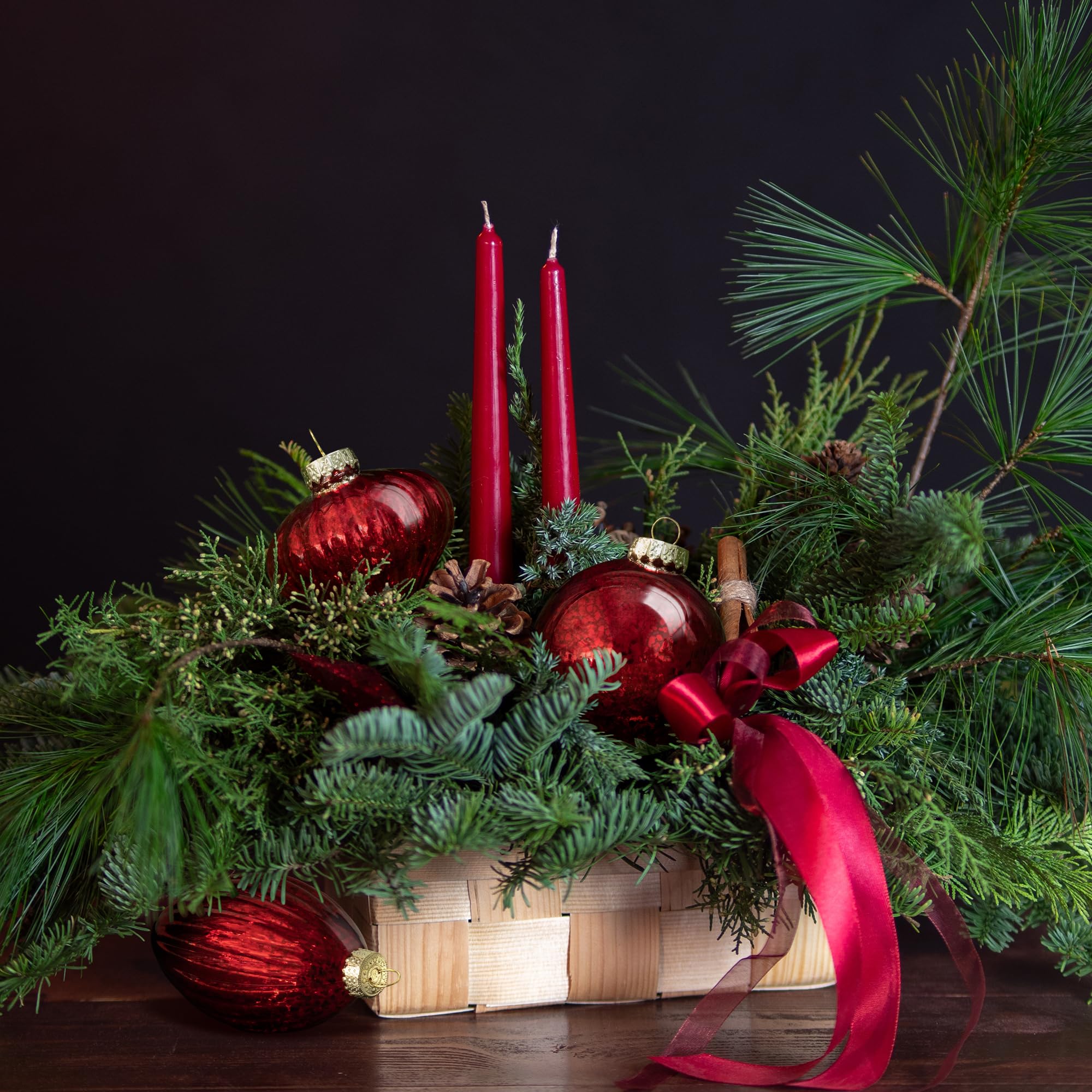 KI Store ornaments hanging on a decorated tree adding warm vintage glow and balance