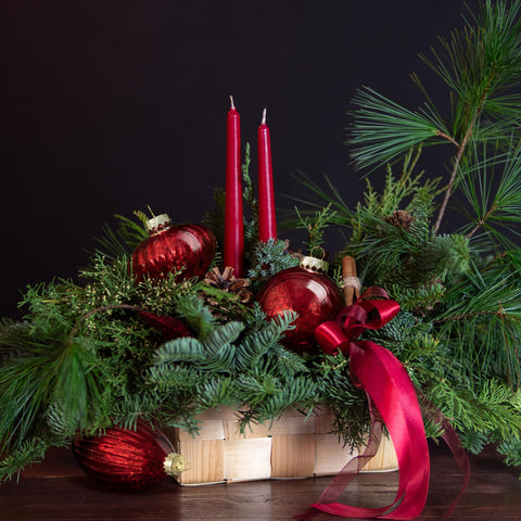 KI Store ornaments hanging on a decorated tree adding warm vintage glow and balance