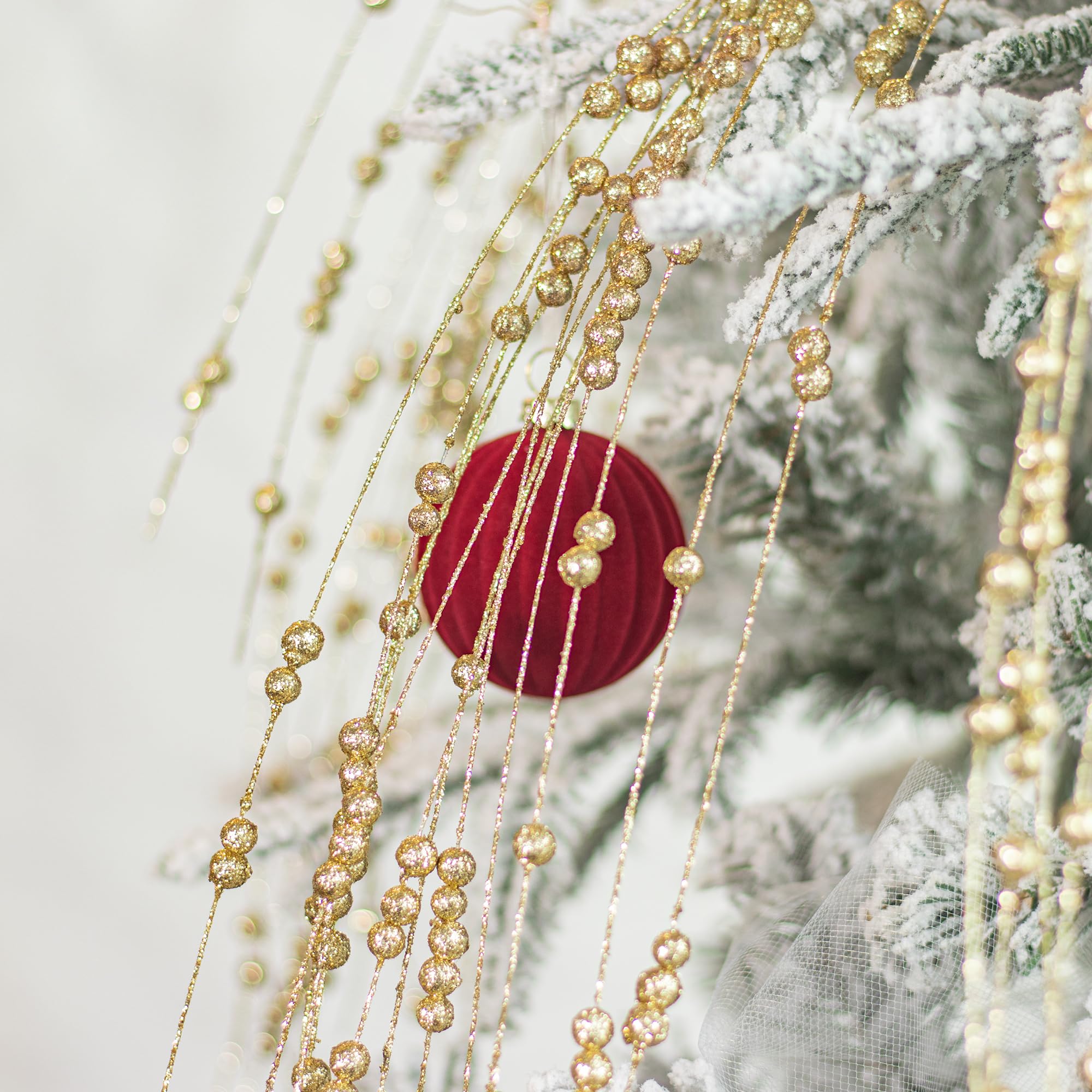 KI Store ornaments hung on tree showing rich burgundy coordinating benefit