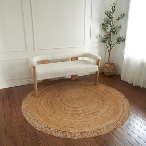 KIBAGA rug styled in living room under coffee table for cozy, grounded look