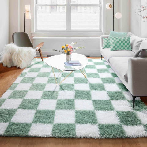 KICMOR rug scaled next to a sofa to illustrate true 5x8 size fit