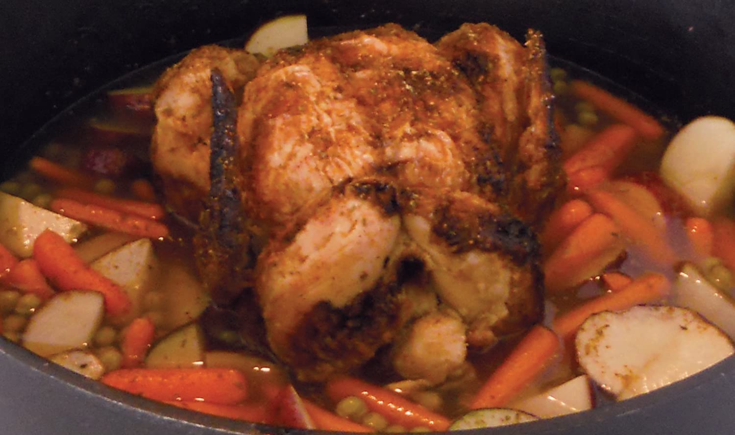 King Kooker lid close-up showing cast iron fit and heat-retention benefit