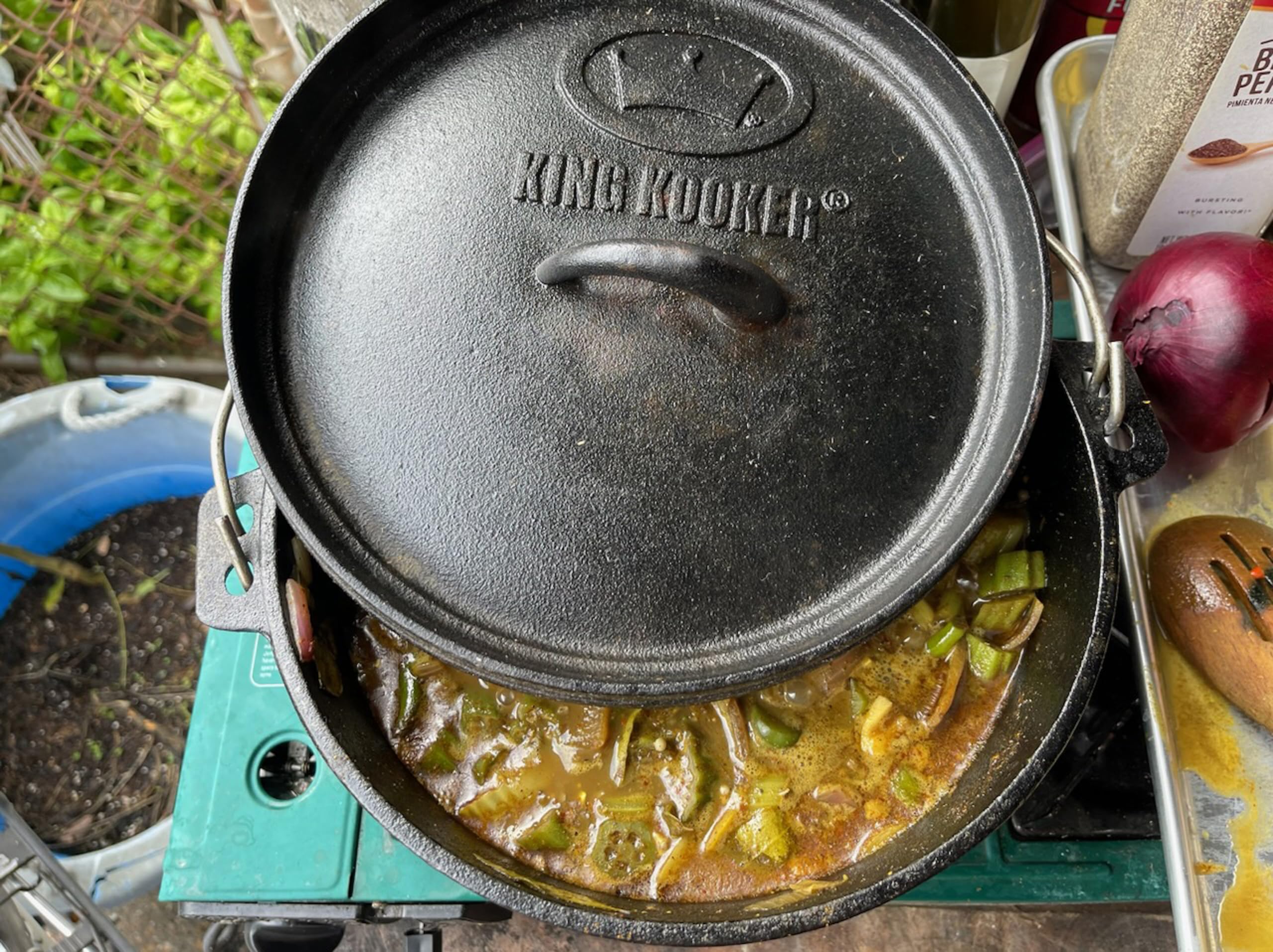 King Kooker Dutch oven in use at campsite demonstrating reliable outdoor cooking benefit