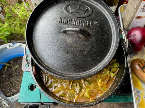 King Kooker Dutch oven in use at campsite demonstrating reliable outdoor cooking benefit