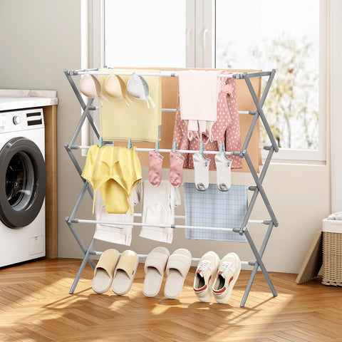 KINGBOARD holding delicates and baby clothes showing gentle drying benefit
