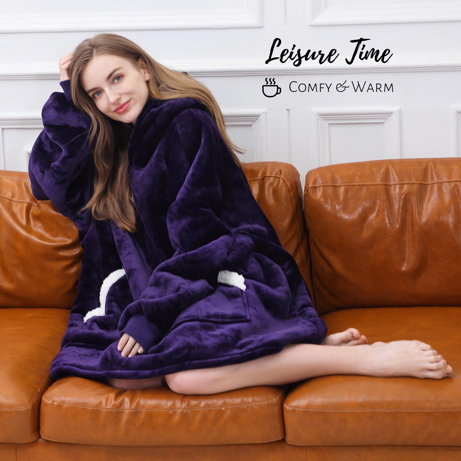 Kipswiza model wearing hoodie blanket on couch demonstrating mobility