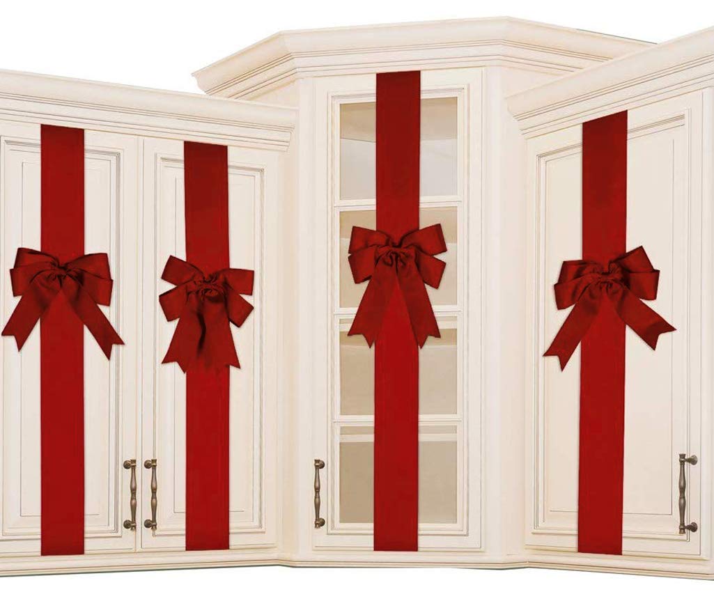 K KIRKWOOD KITCHEN front view of four red cabinet bows, festive kitchen upgrade