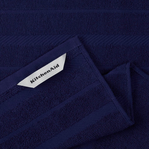 KitchenAid towel drying glassware to show effective dish drying and non-abrasive benefit