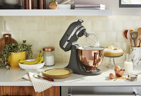 KitchenAid bowl beside measuring cup showing 5-quart capacity for batches
