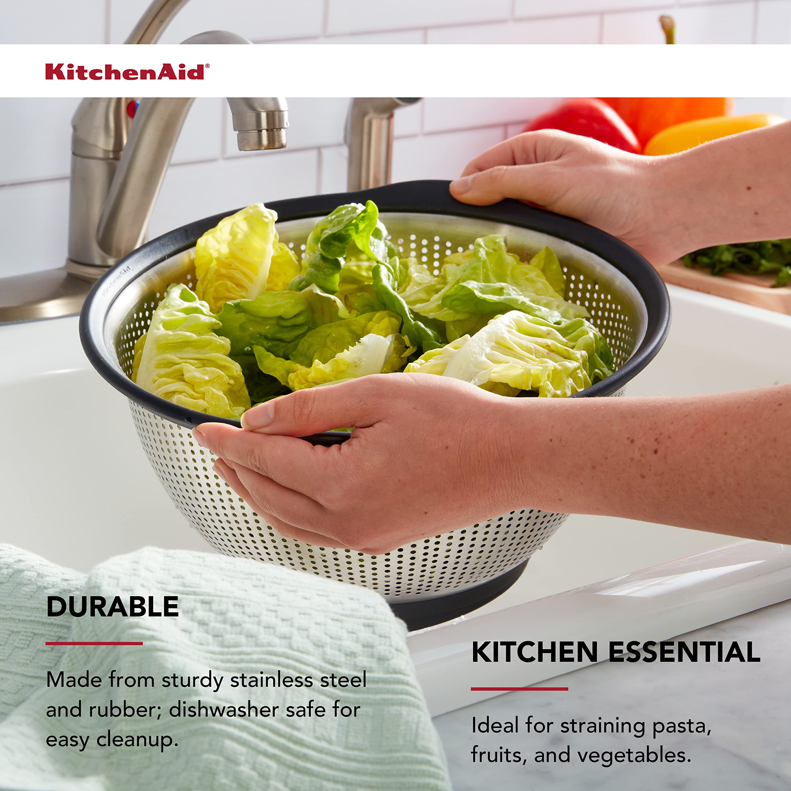 KitchenAid colander in sink draining pasta demonstrating stability and safety benefit