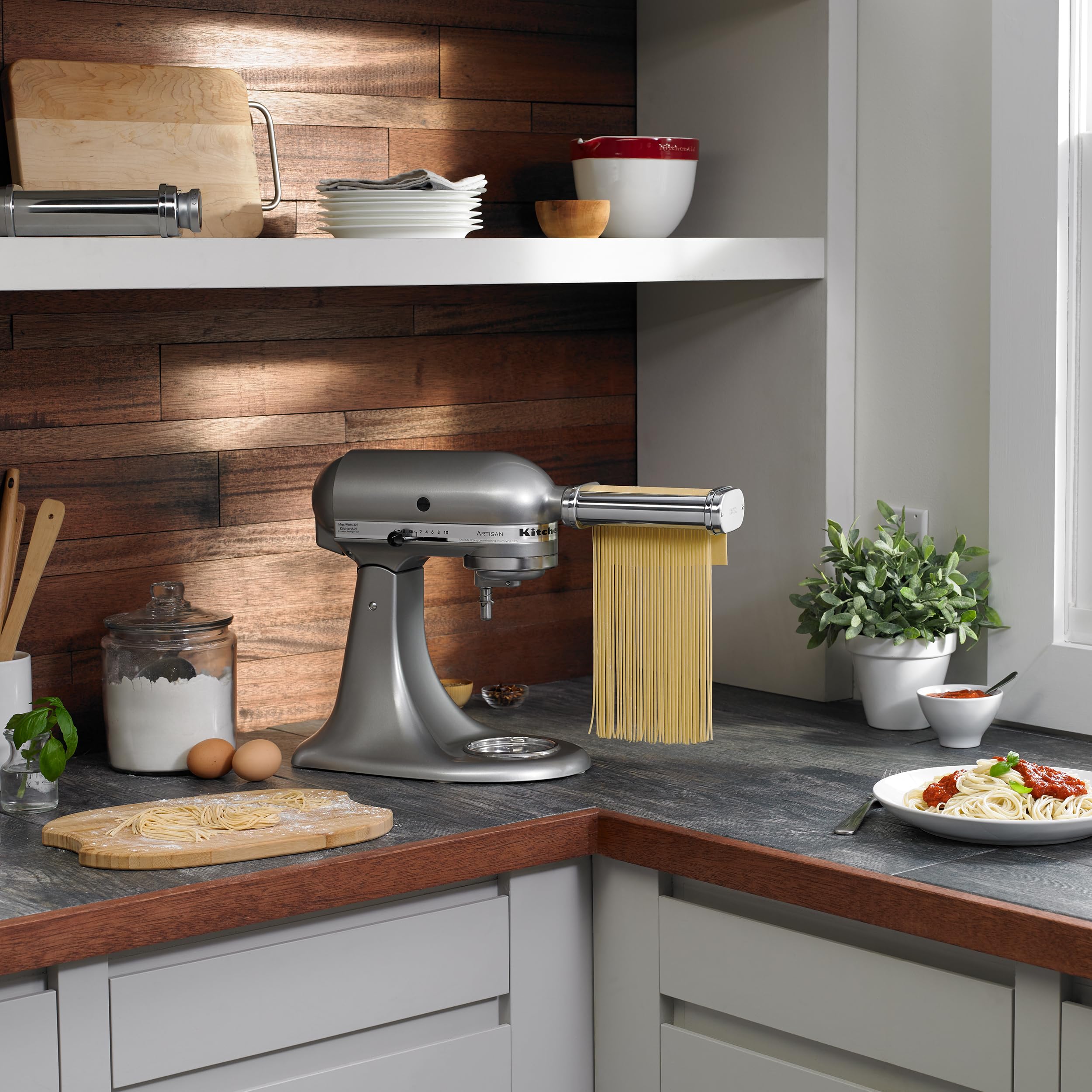 KitchenAid cutters and cleaning brush displayed for easy maintenance