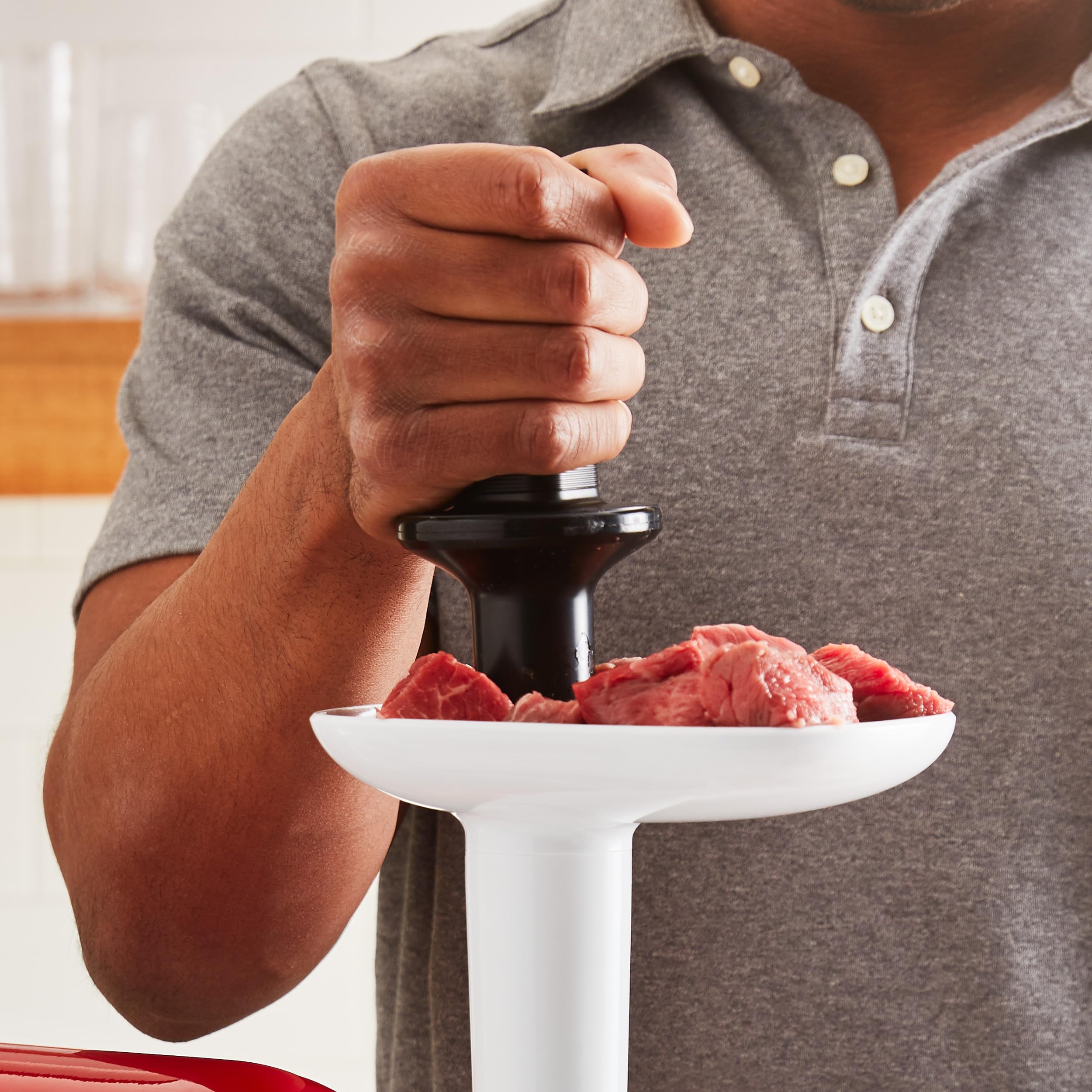 KitchenAid food tray attached to grinder in use showing continuous feeding benefit