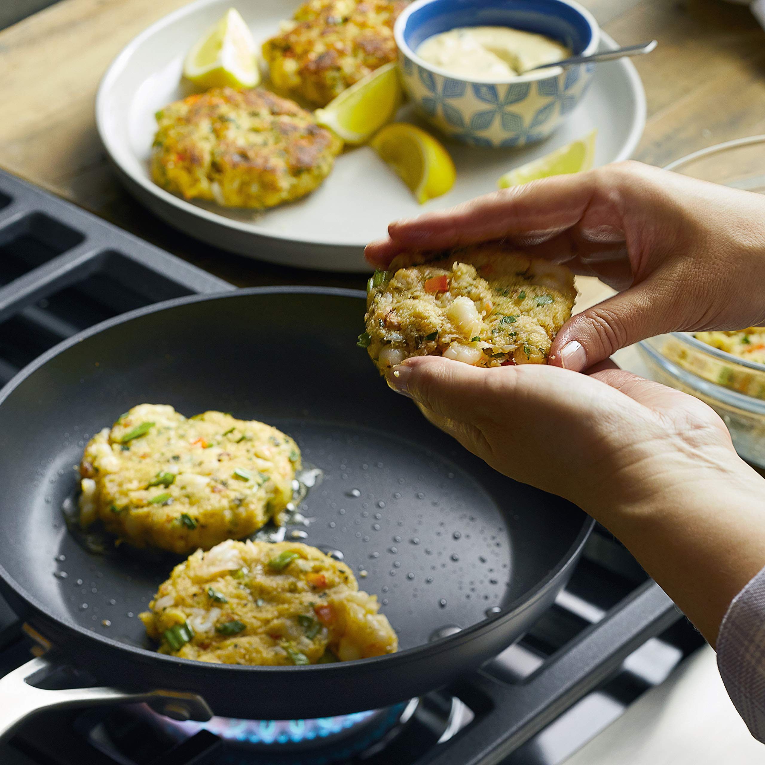 KitchenAid 10-inch pan sautéing vegetables in a home kitchen for versatile everyday cooking