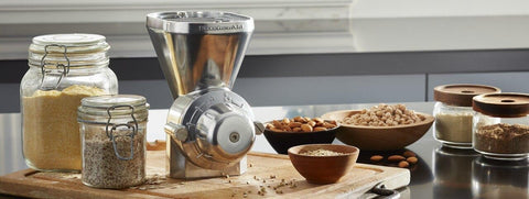 KitchenAid grain mill displayed with milled flour and whole grains, fresh-flour flavor advantage