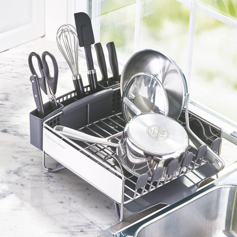 KitchenAid dish rack in kitchen setting drying plates and glasses for tidy countertops