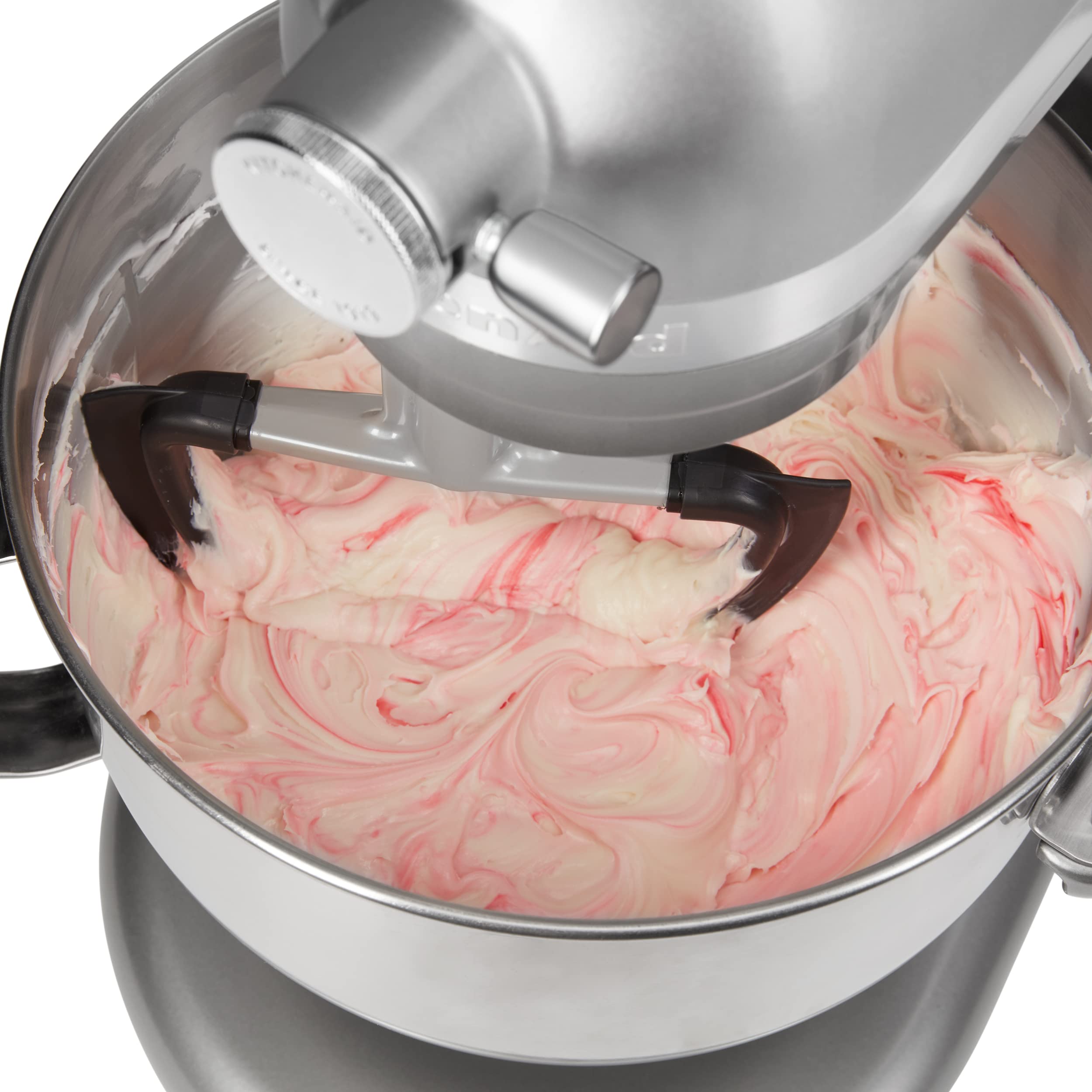 KitchenAid beater beside measuring cup showing compact size and compatibility