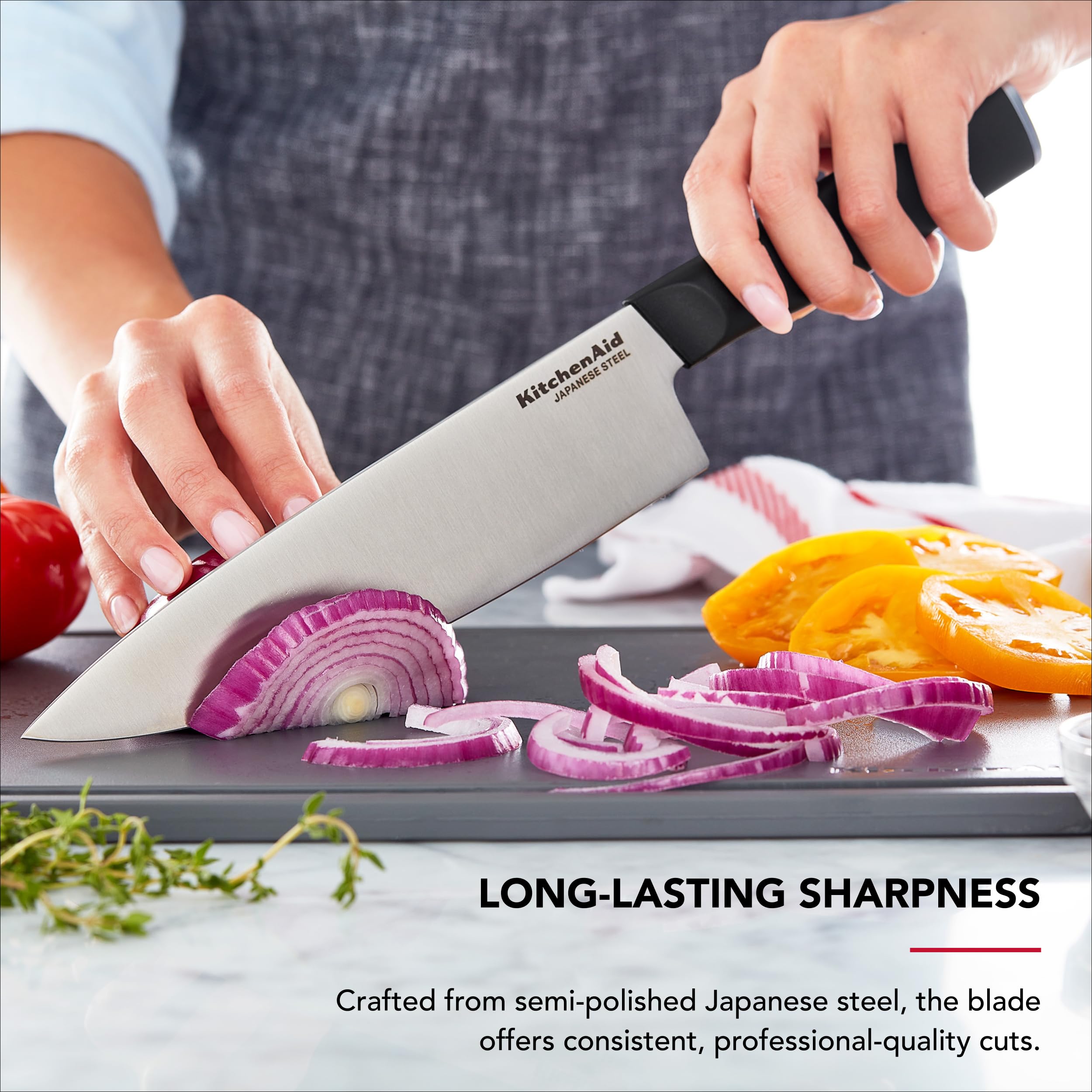 KitchenAid chef knife slicing vegetables for precise, effortless cuts