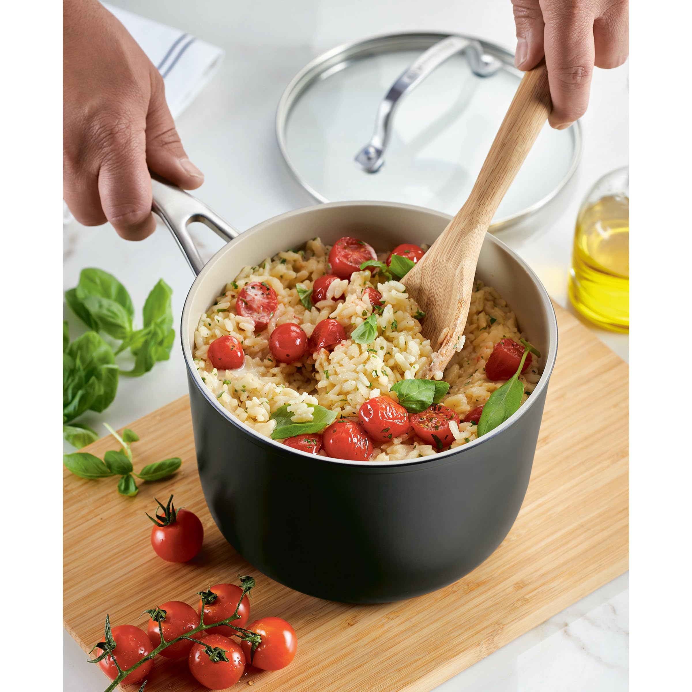 KitchenAid on stovetop simmering sauce showing even heat distribution benefit