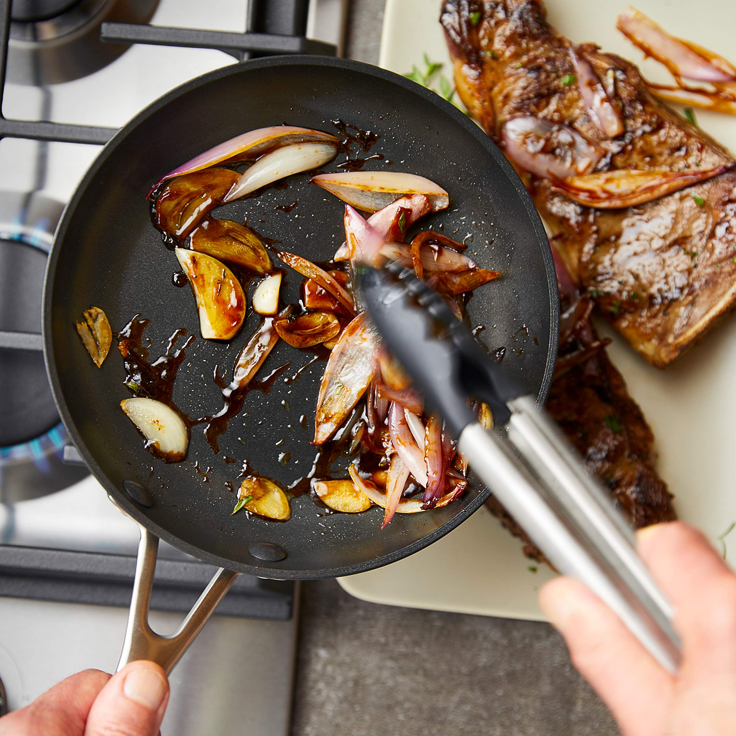 KitchenAid skillet inside oven with roasted vegetables showing oven-safe up to 500°F versatility