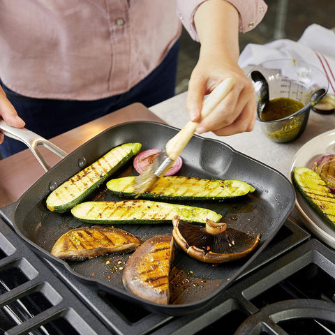 KitchenAid pan inside oven showing oven-safe capability for finishing at high temperatures