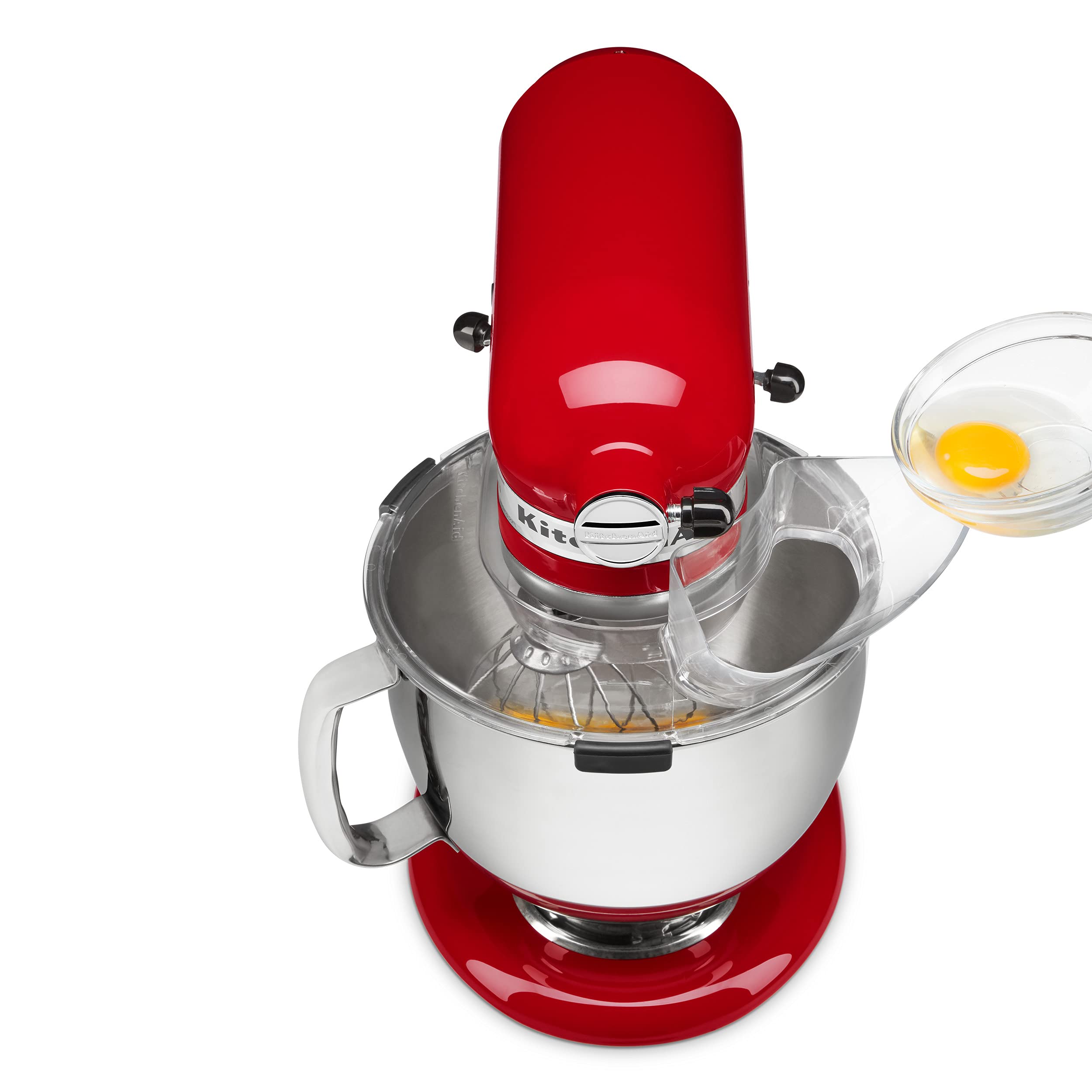 KitchenAid pouring shield attached to mixer in use reduces mess while adding ingredients